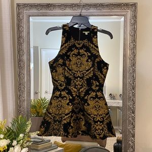 Jacquard top. Incredibly regal feel and lined. Pleated peplum. Interesting back.